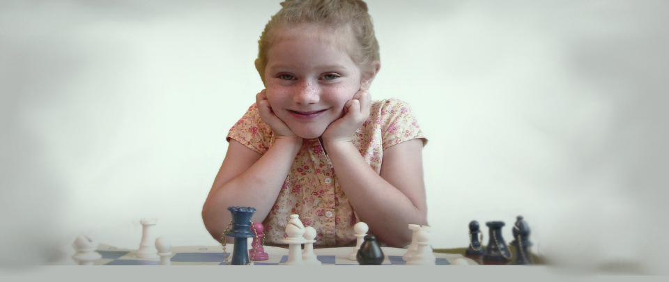 Girl happy with chess game